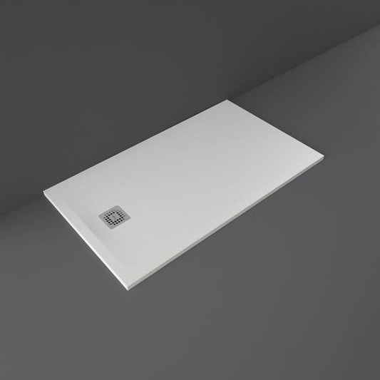 Rectangular white shower tray with a drain on a dark gray background