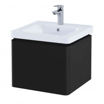 Black vanity unit with white ceramic sink and silver faucet on a white background